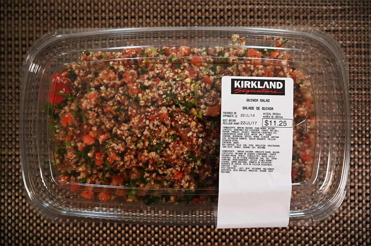 Tray of Costco Kirkland Quinoa Salad sitting on a table, top down image.