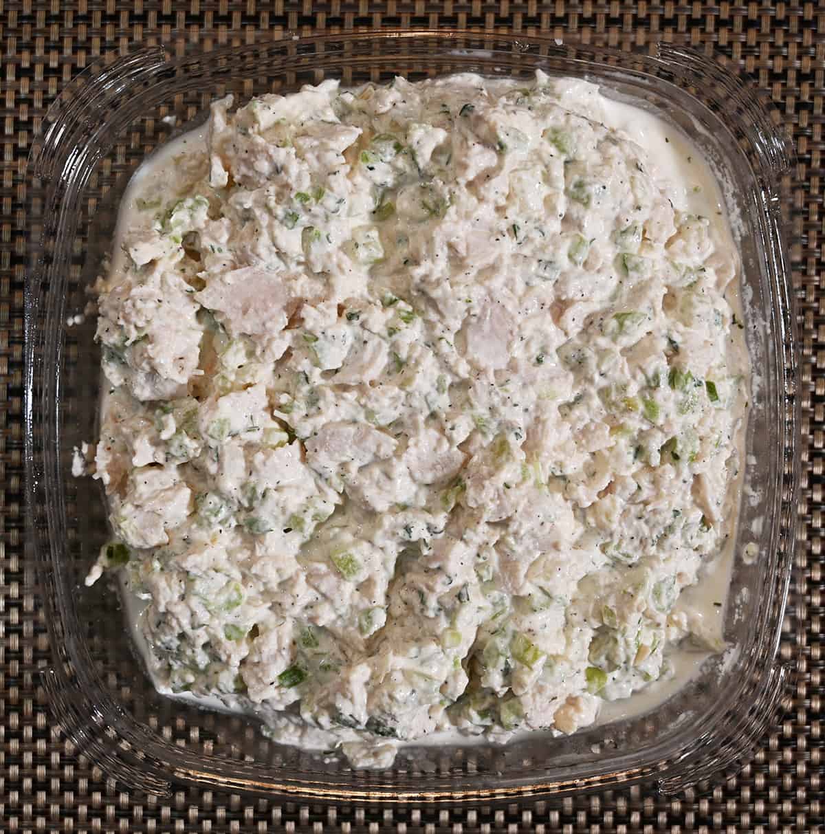 Top down image of an open container of the Costco Kirkland Signature Chicken Salad showing what the salad looks like.