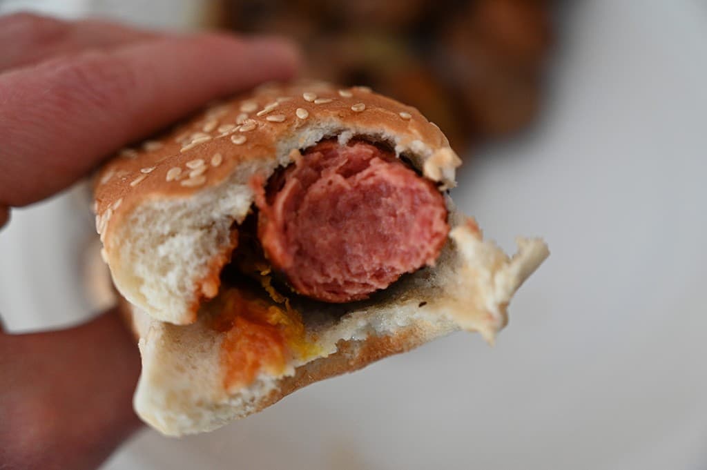 Closeup image of a Costco hot dog with a bite taken out of it. 