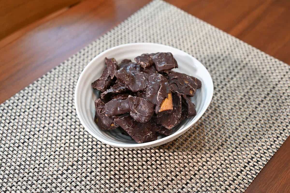 Costco chocolate covered mangoes poured into a white bowl. 