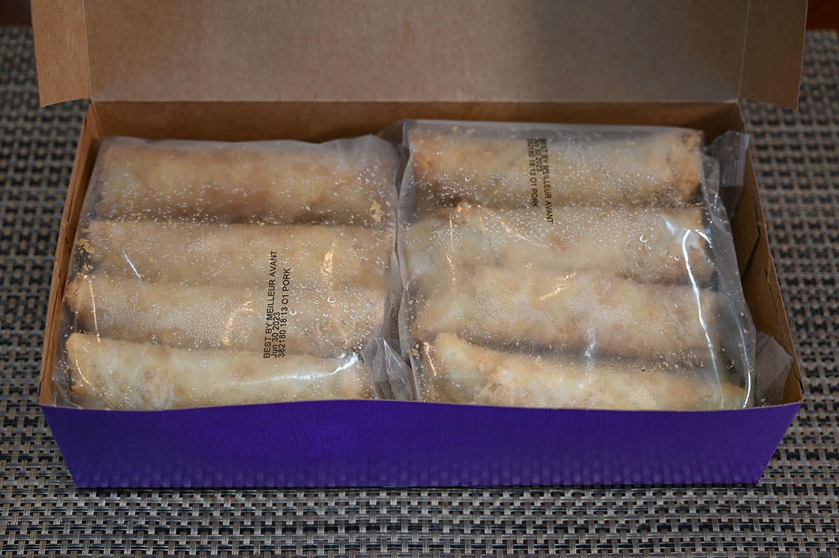 Image of the box of egg rolls opened so you can see the two bags containing eight egg rolls in each bag.