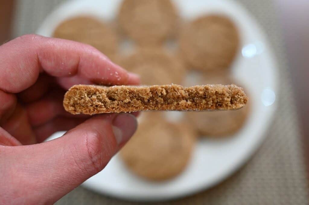 Costco Kirkland Signature Ginger Cookies closeup photo of a ginger cookie with a bite taken out of it