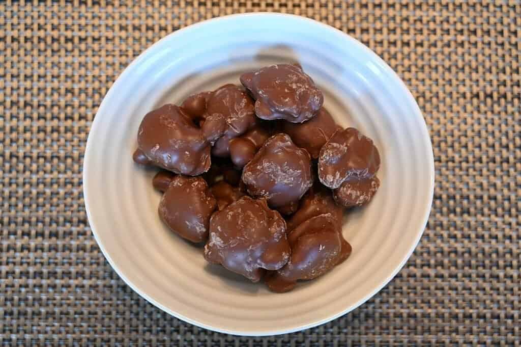 Top view image of the Costco Kirkland Signature Macadamia Clusters container in a bowl 