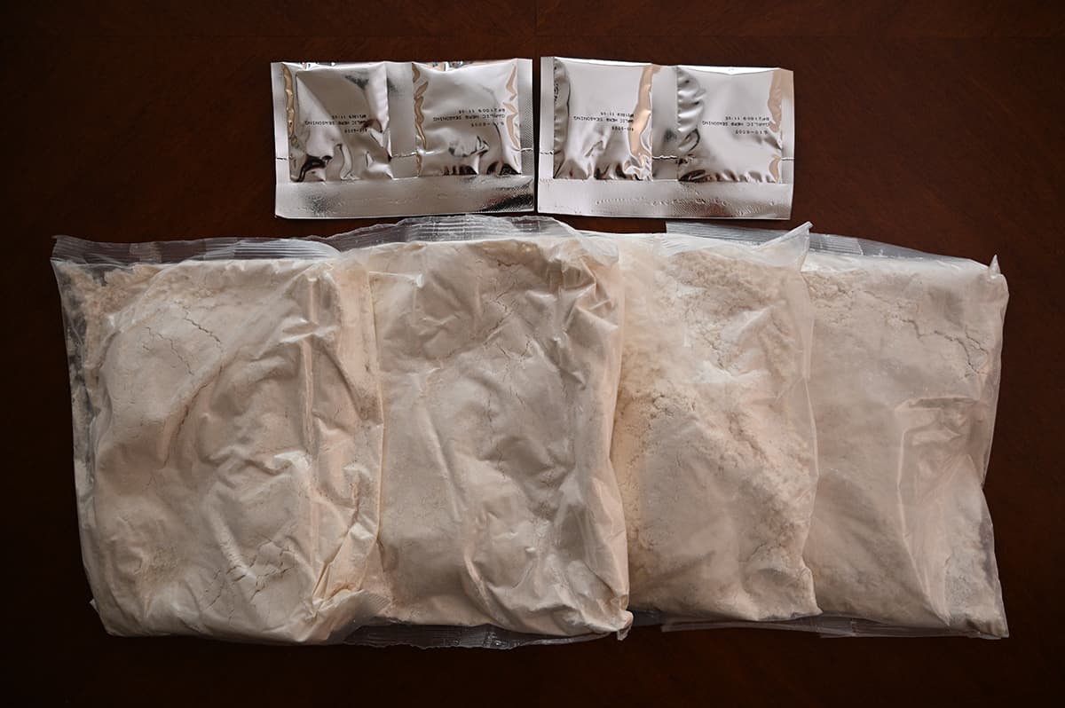 Image showing the four bags of mix and four packets of garlic butter seasoning that comes in the box.