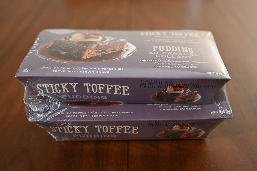 Image of the two pack of I the Costco The Sticky Toffee Pudding Co. Sticky Toffee Pudding sitting on a table. Side view image 