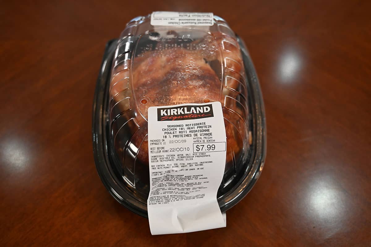 Image of the Costco Kirkland Signature Rotisserie Chicken container sitting on a table, top down image.