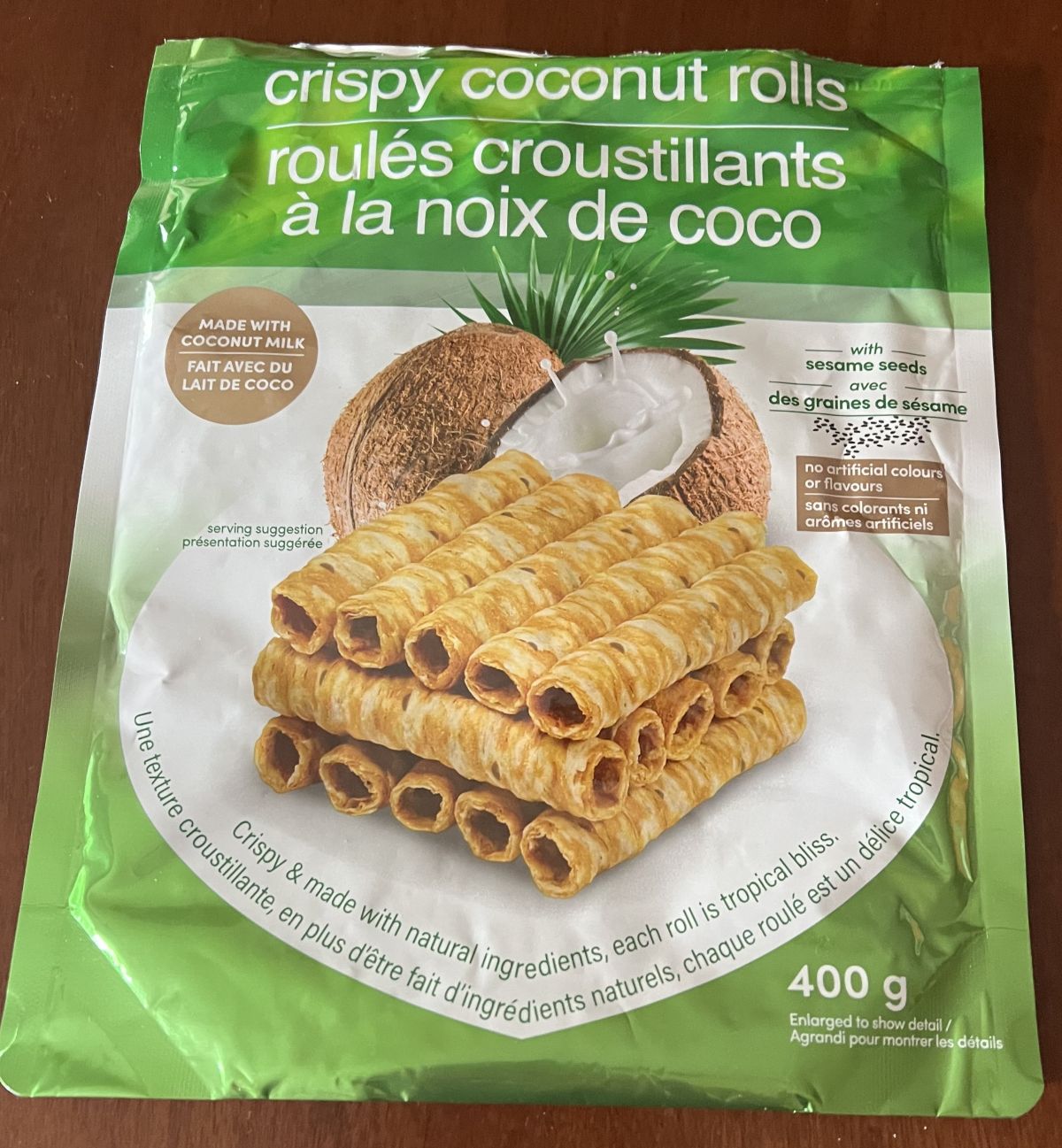 Closeup image of the bag of the Costco Tropical Fields Crispy Coconut Rolls showing the size of the bag and that there are sesame seeds in the rolls.
