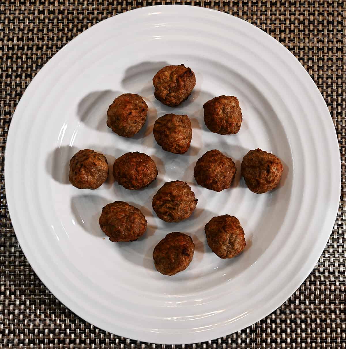 Top down image of a plate of cooked meatballs.