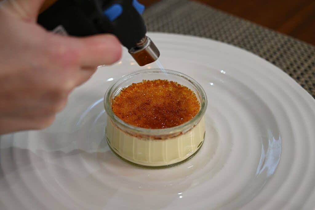 Using a kitchen torch on the Costco Marie Morin Crème Brûlée.