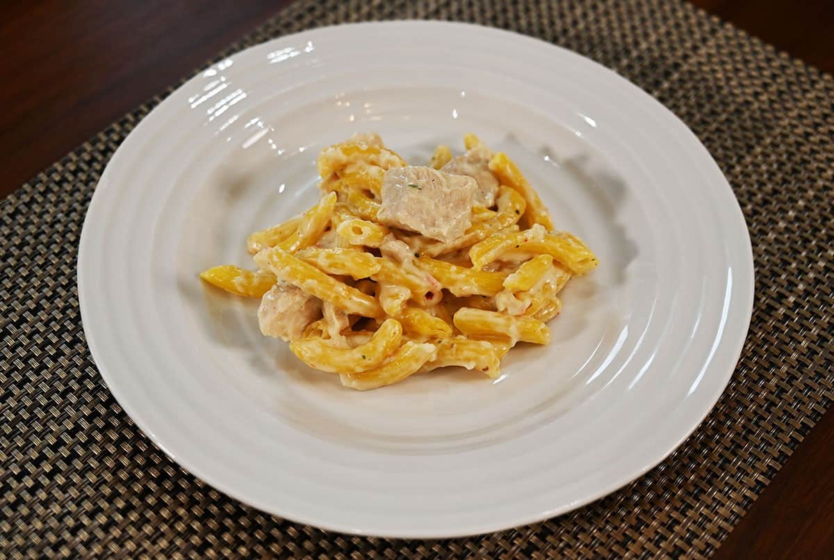 Costco chicken penne alfredo plated on a white plate after cooking. 