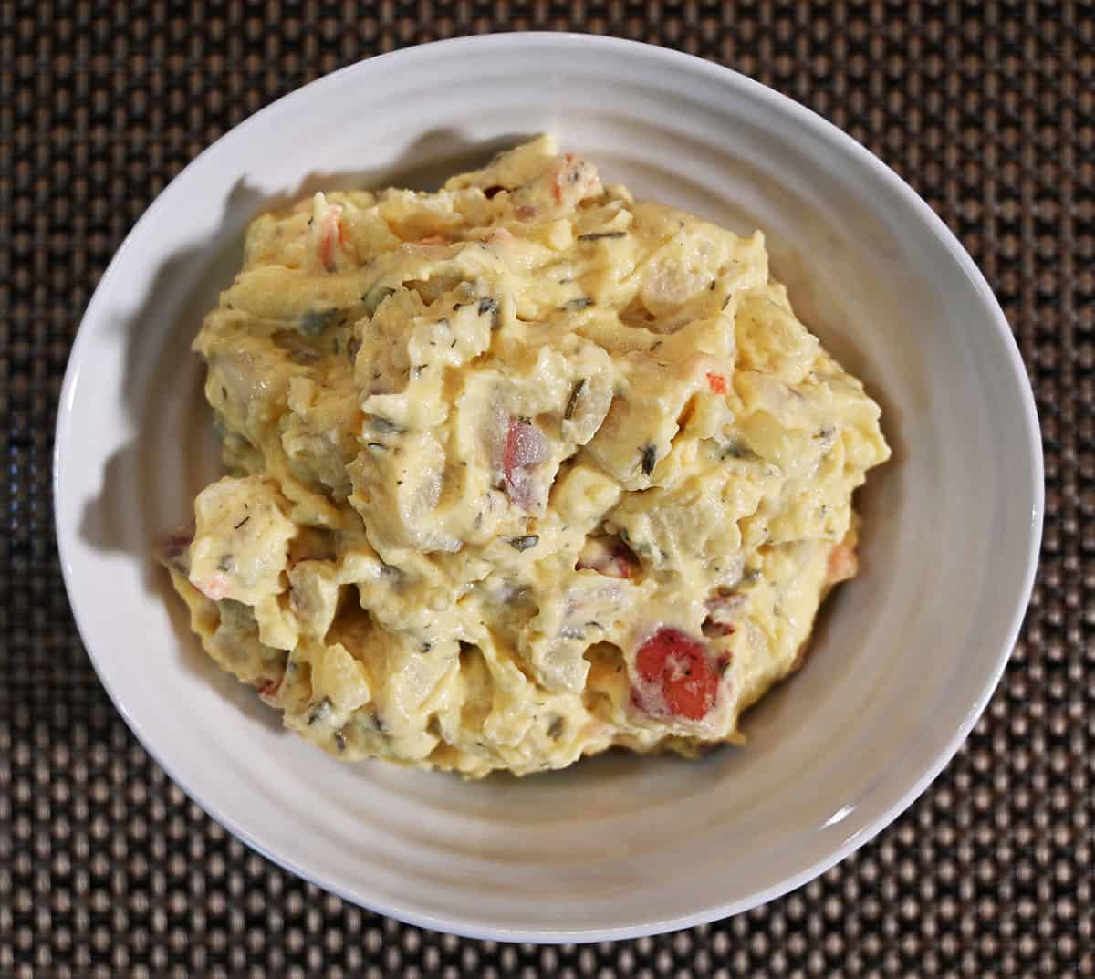 Close up image of the Costco Stonemill Kitchens Homestyle Red Potato Salad served in a white bowl.