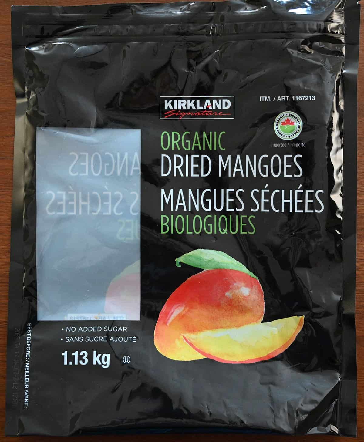 Closeup image of the Costco Kirkland Signature Organic Dried Mangoes bag empty and flattened. 