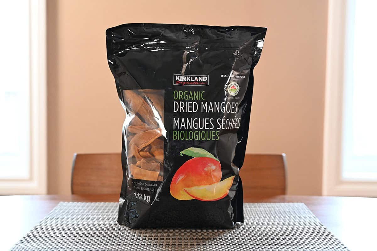Costco Kirkland Signature Organic Dried Mangoes bag sitting on a table. 