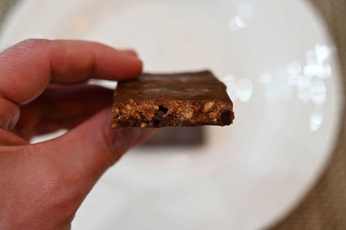 A close-up of the peanut butter chocolate RXBAR with a bite out of it.