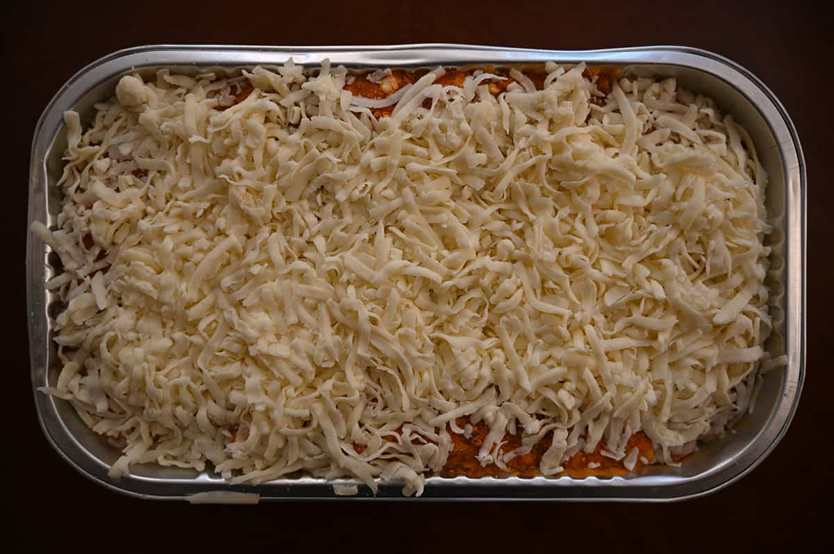 Top down image of a Costco lasagna with the plastic lid off prior to baking it.