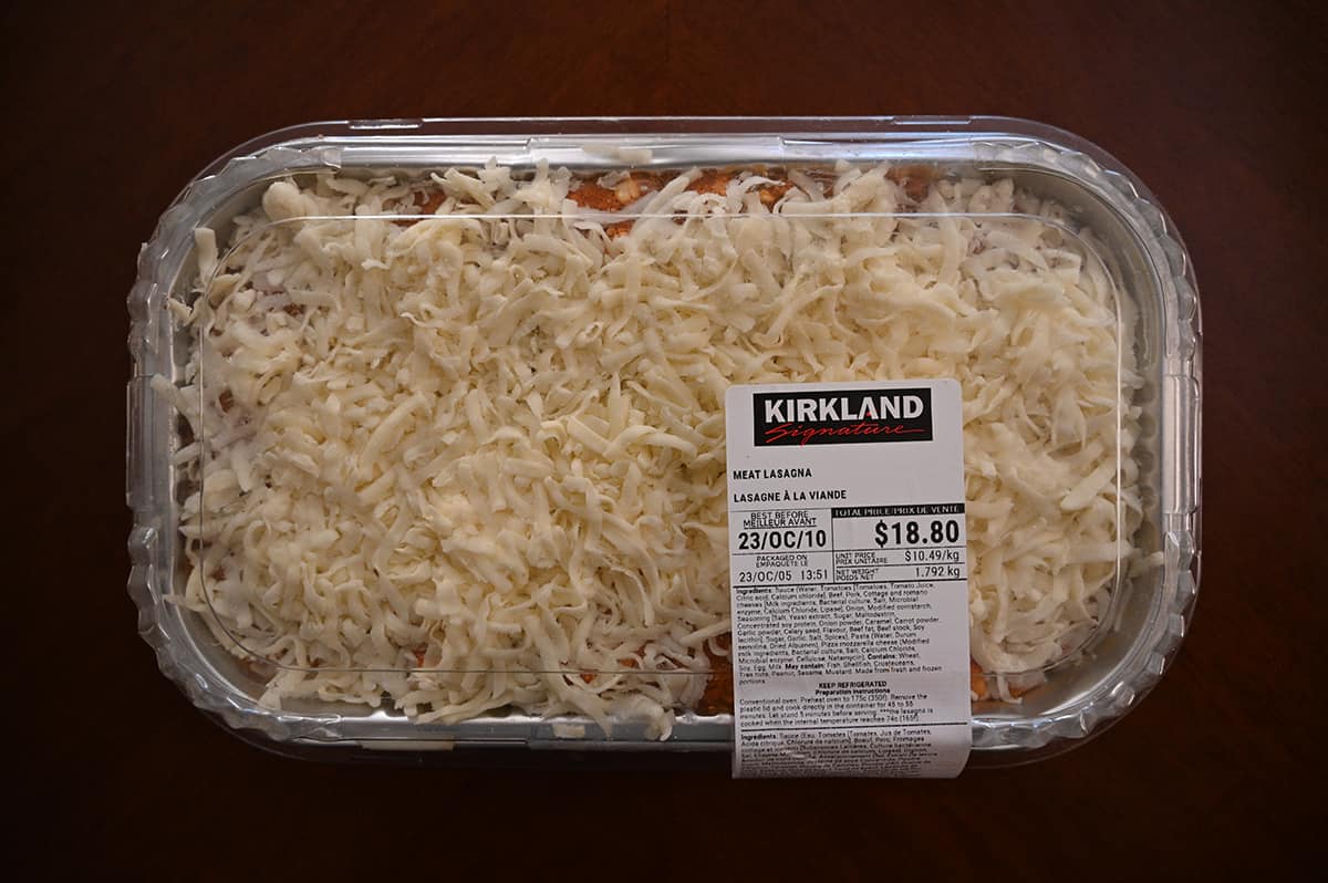 Top down image of the Costco Kirkland Signature Meat Lasagna tray unopened sitting on a table.