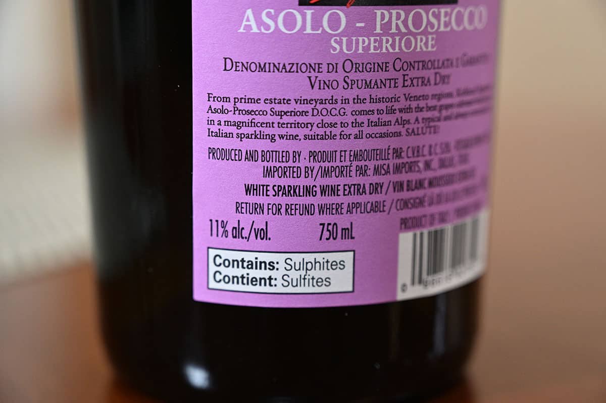 Closeup image of the label on the back of the prosecco stating 11% alcohol content and the prosecco contains sulphites.