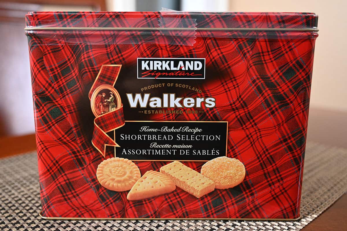 Costco Kirkland Signature Walkers Shortbread tin of cookies sitting on a table, side view image. 