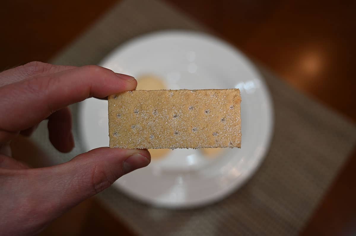 Image of a hand holding one of the shortbread finger cookies.