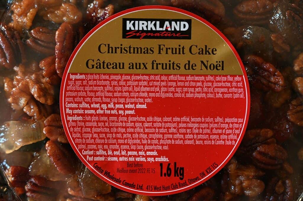 Close up image of the Costco Kirkland Signature Christmas Fruit Cake label that comes on the packaging that has ingredients 