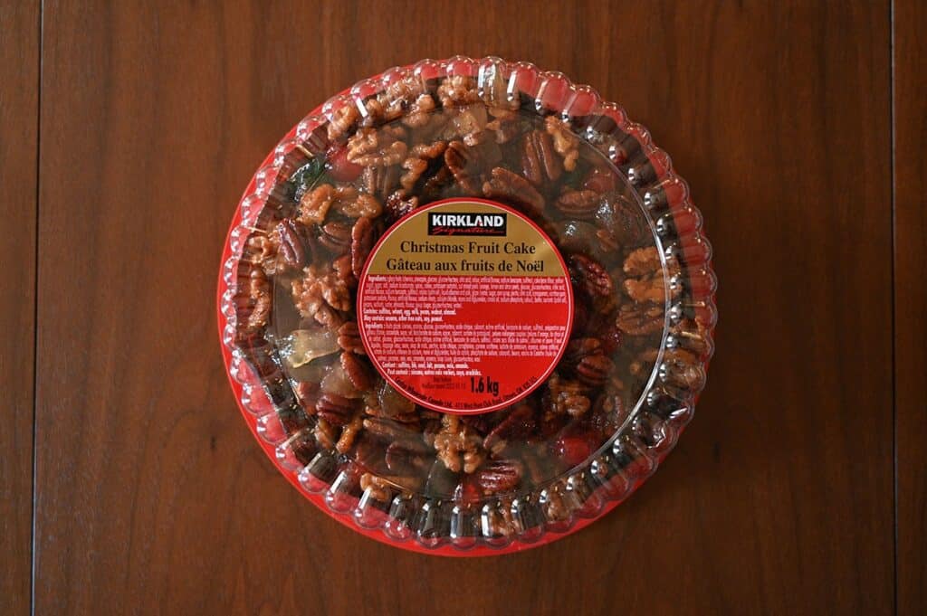 Top down Image of the Costco Kirkland Signature Christmas Fruit Cake in packaging sitting on a table