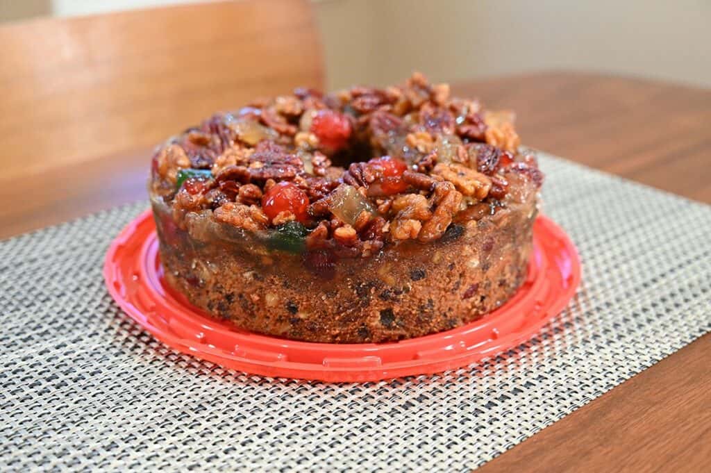 Side image of the Costco Kirkland Signature Christmas Fruit Cake without the lid on 