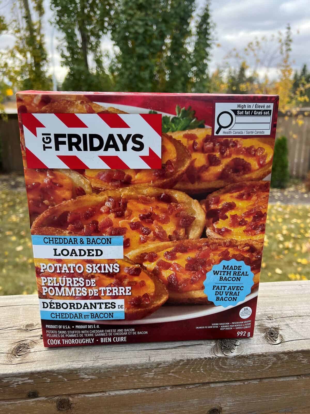 Image of the Costco TGI Fridays Loaded Potato Skins box sitting on a table unopened.