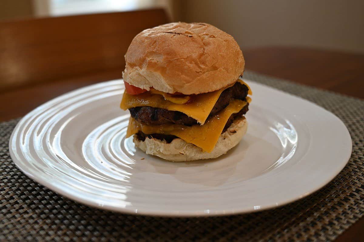 Image of a prepared Costco The Keg Prime Rib Beef Burger on a bun with cheese. 