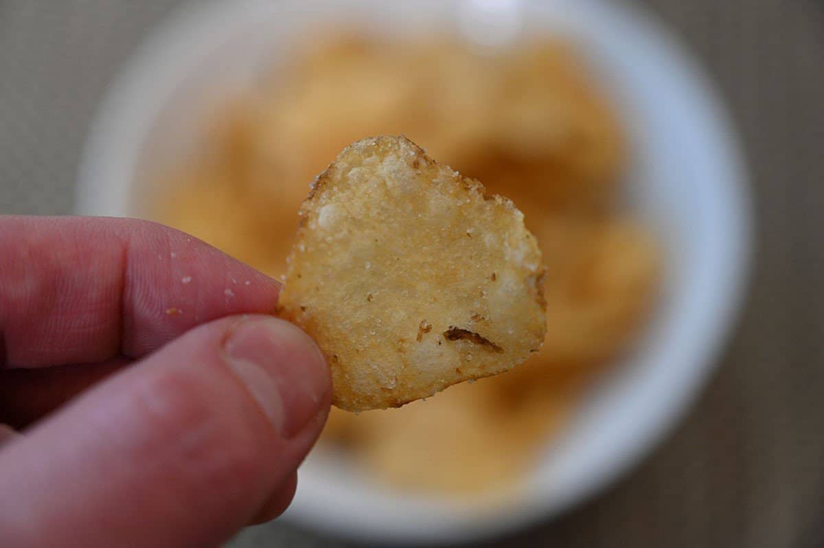 Closeup image of one Costco Delicious Snacks Sweet Maui Onion Kettle Chip