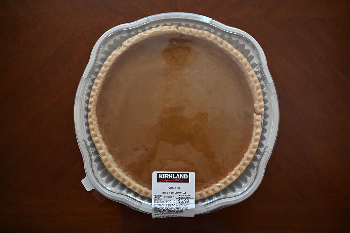 Image of the pumpkin pie in the container, top down image.