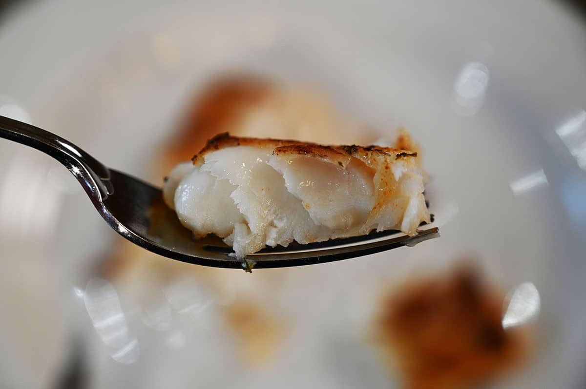 Closeup image of one bite of Costco Miso Glazed Cod on a fork/