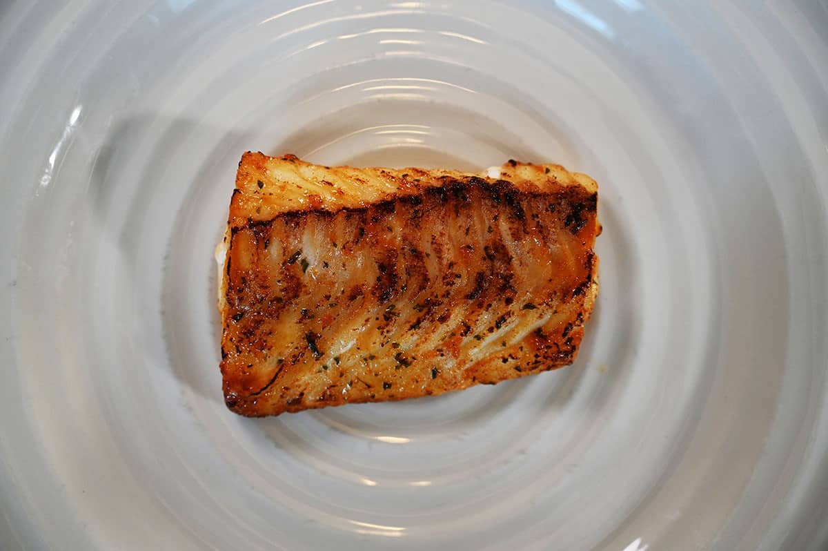 Costco High Liner Miso Glazed Cod  cooked and served on a white plate, top down image. 