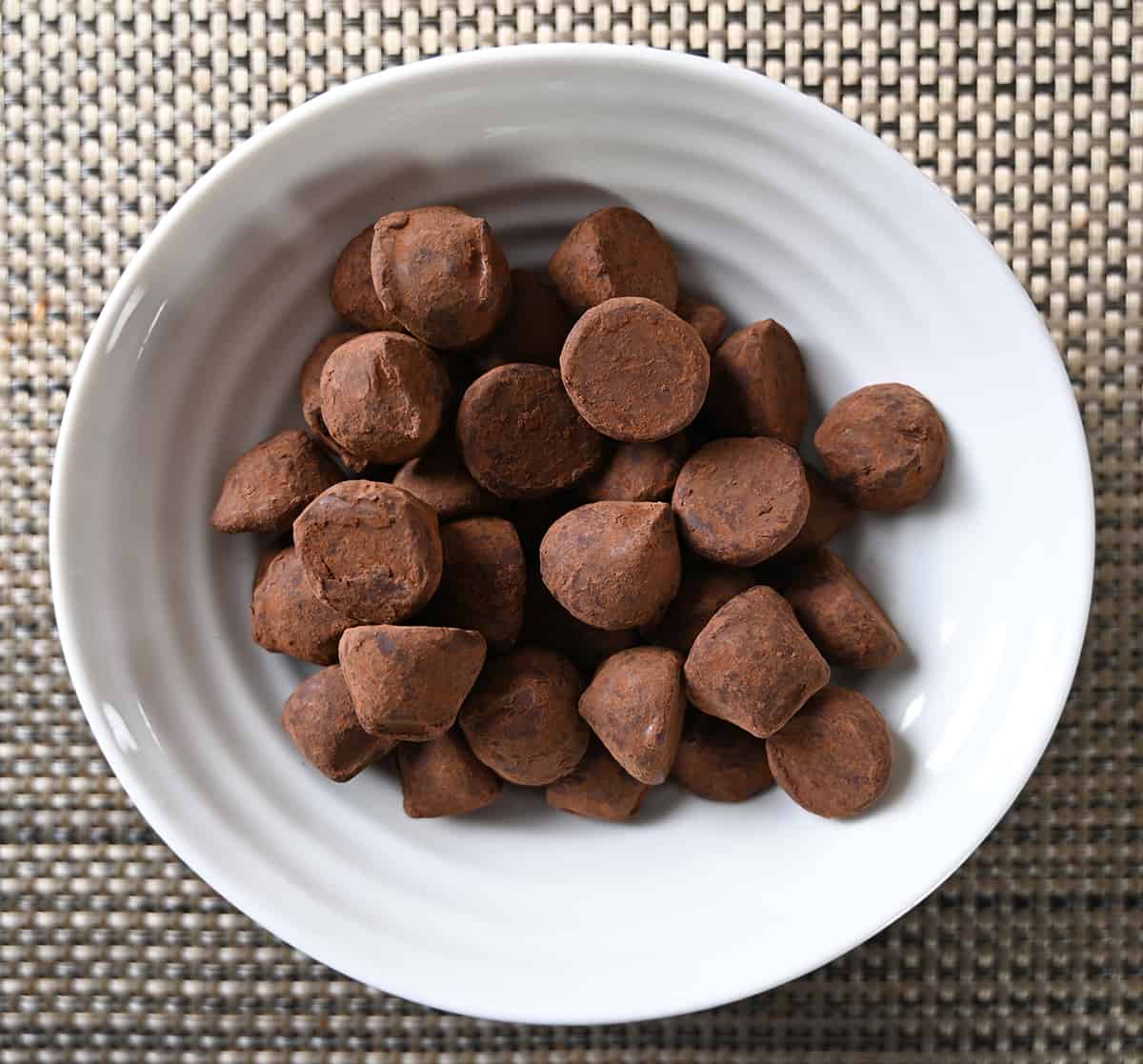 Top down image of a bowl of truffles sitting on a table.