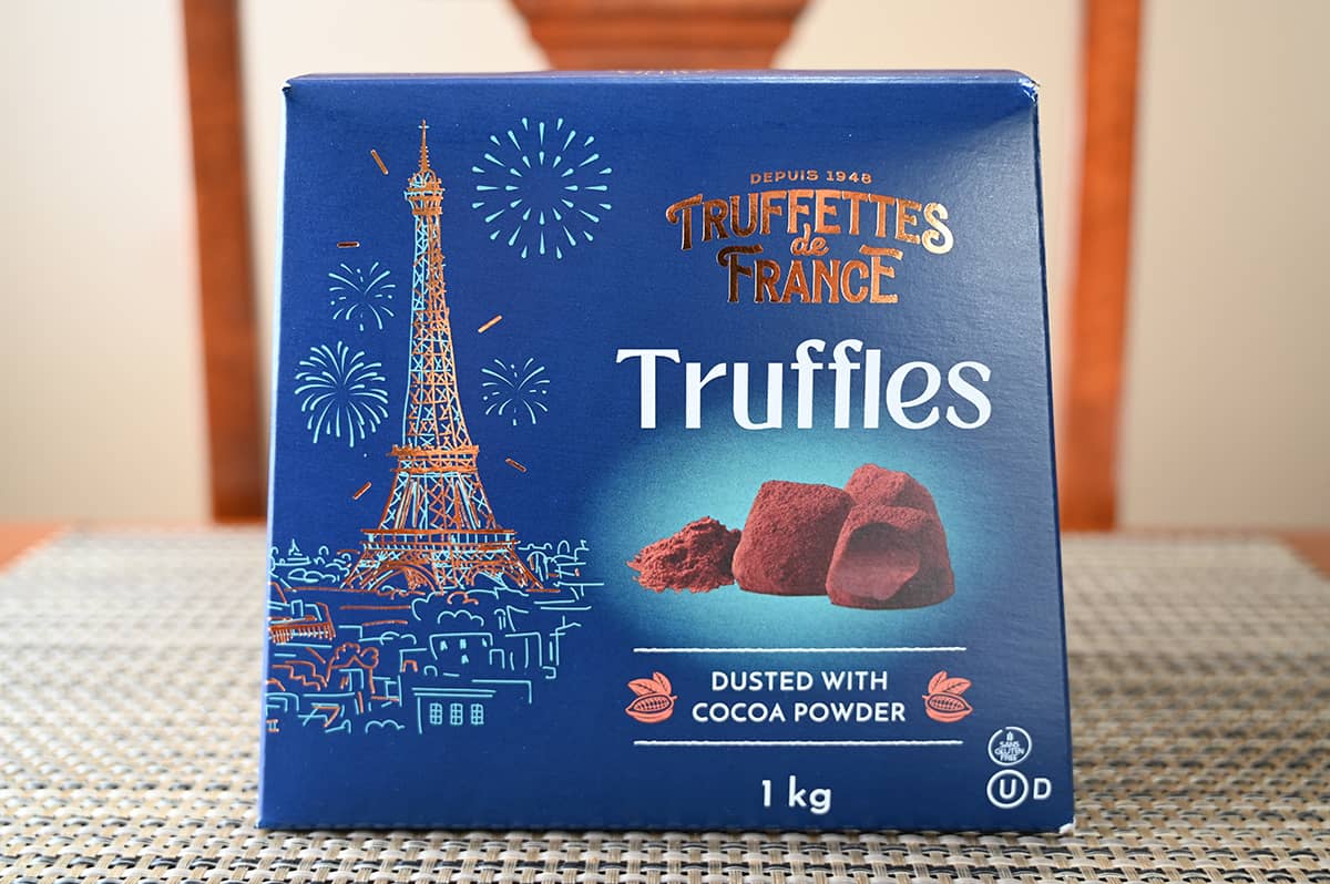 Image of a one kilogram box of truffles unopened sitting on a table.