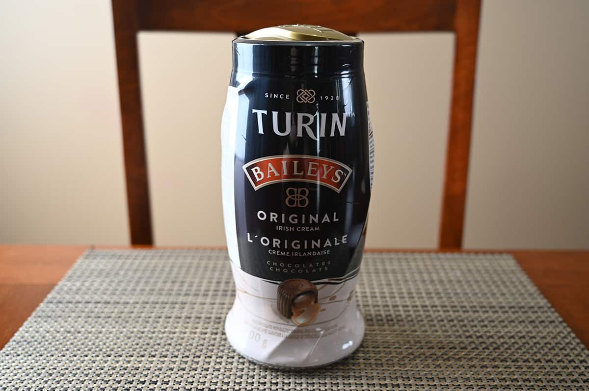 Image of the Costco Baileys Original Irish Cream Chocolates container sitting on a table unopened. 