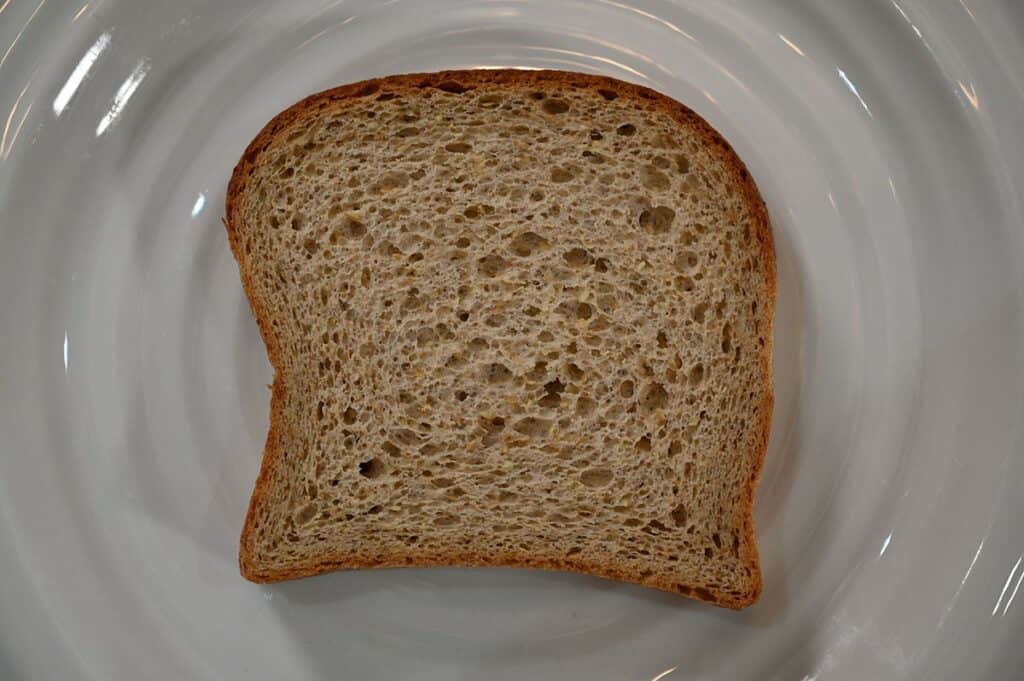 Image of a slice of Costco Carbonaut White Bread not toasted and on a plate