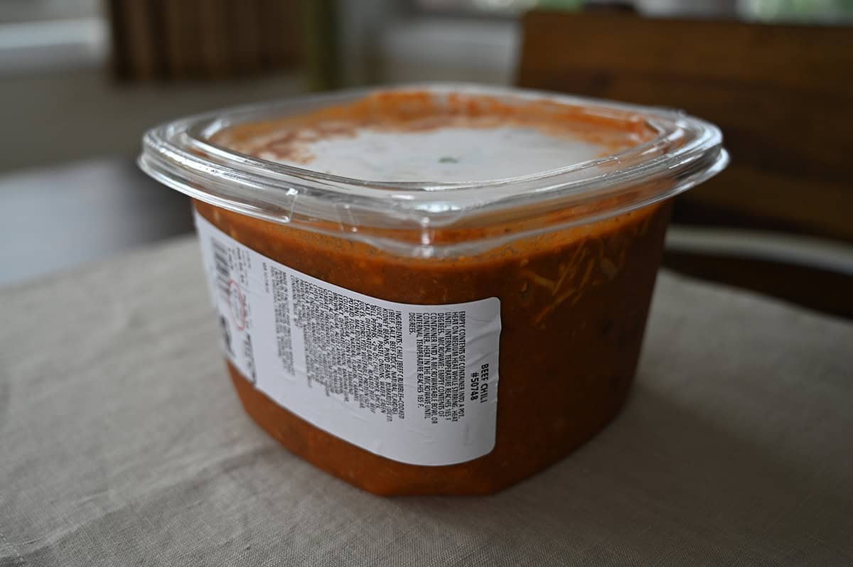 Image of the Costco Kirkland Signature Beef Chili container sitting on a table unopened.