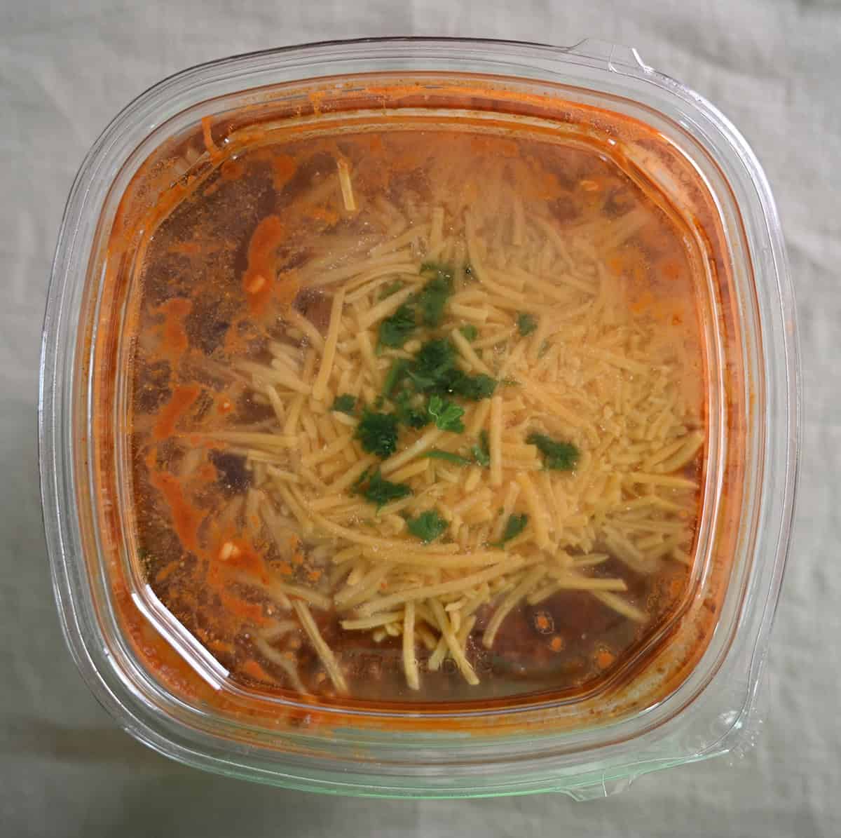 Top down image of the Costco Kirkland Signature Beef Chili container showing what the chili looks like in the container. 