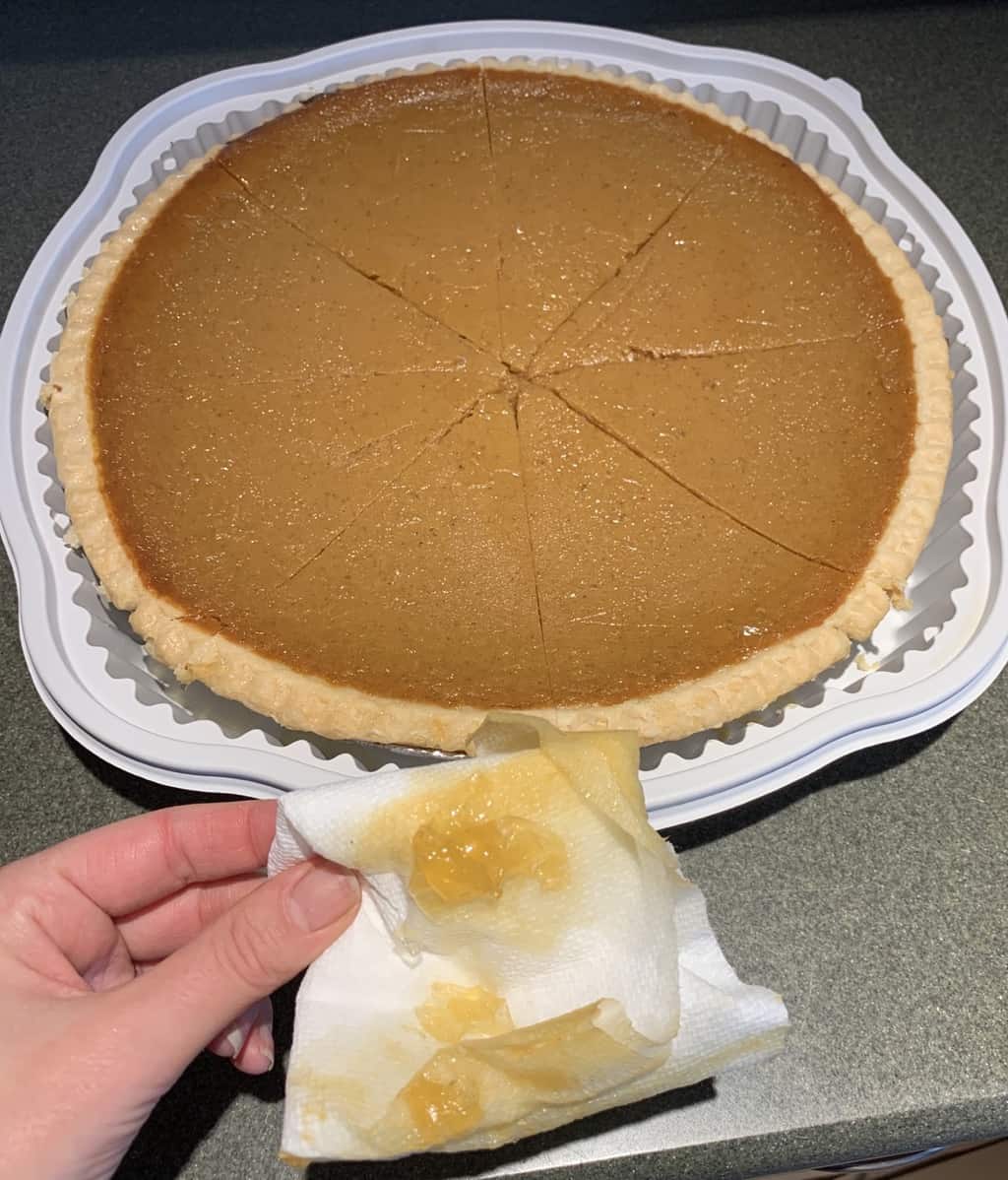 The Pumpkin Pie after removing the excess moisture and gel from the top with a piece of paper towel. The piece of paper towel that was used is shown.