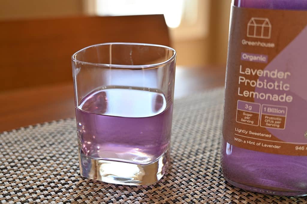 Photo of a glass of Costco Greenhouse Lavender Organic Probiotic Lemonade.