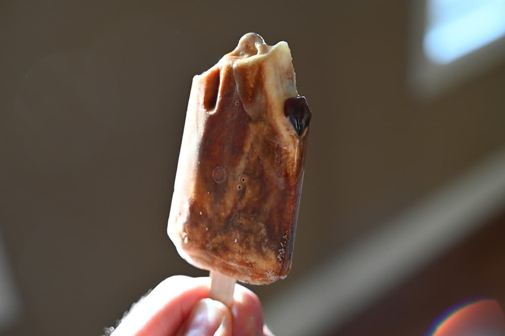 Photo of a brown sugar boba bar with a few bites out of it so that you can see a tapioca pearl.