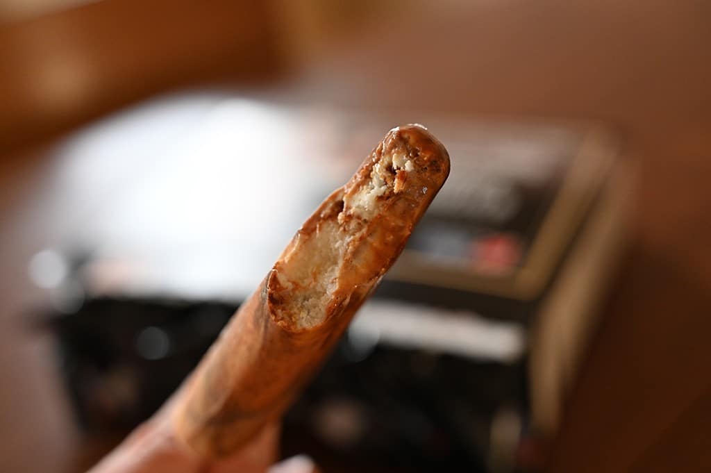 Photo of a Costco brown sugar boba bar with a bite out of it.