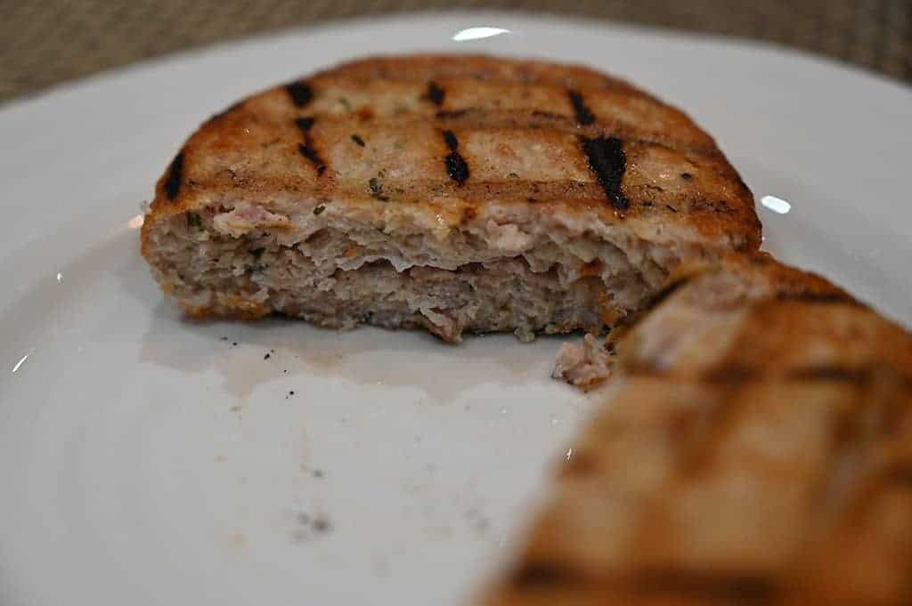 Image of a chicken burger cut in half so you can see the center. 