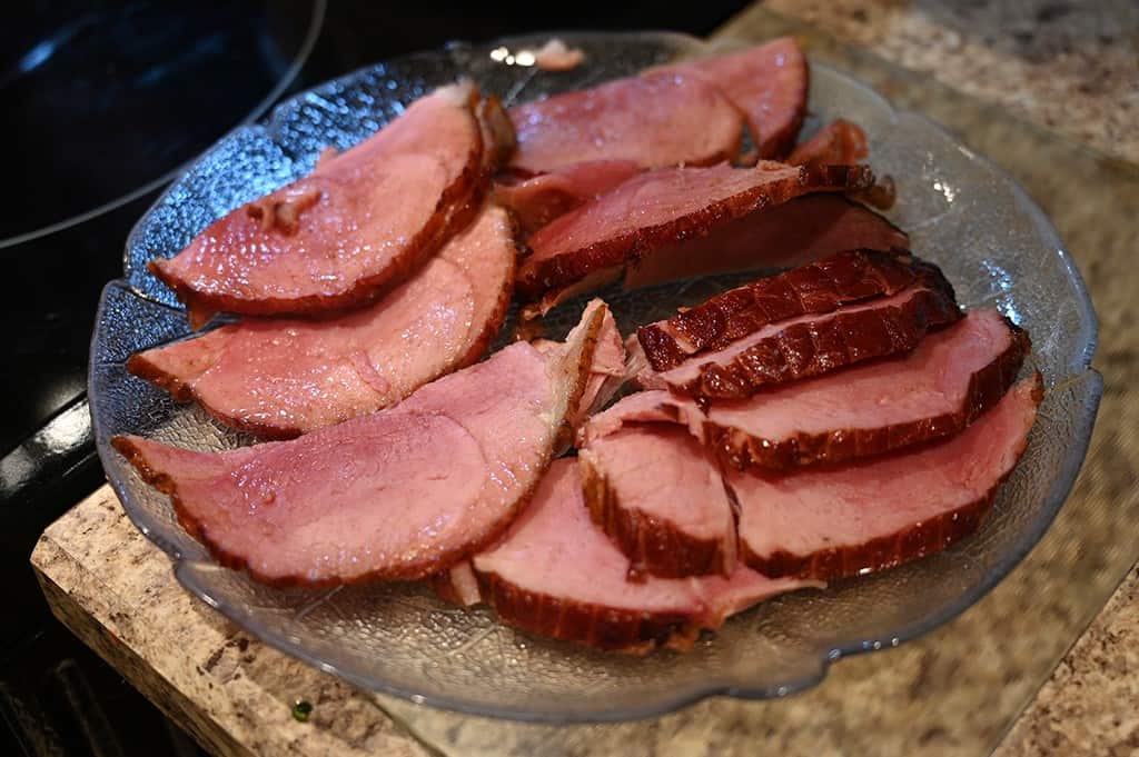 The Costco Kirkland Signature Spiral Sliced Ham sliced on a serving plate.