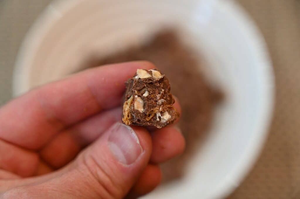 Costco OMG! Milk Chocolate Almond Toffee Clusters with a bite out of it