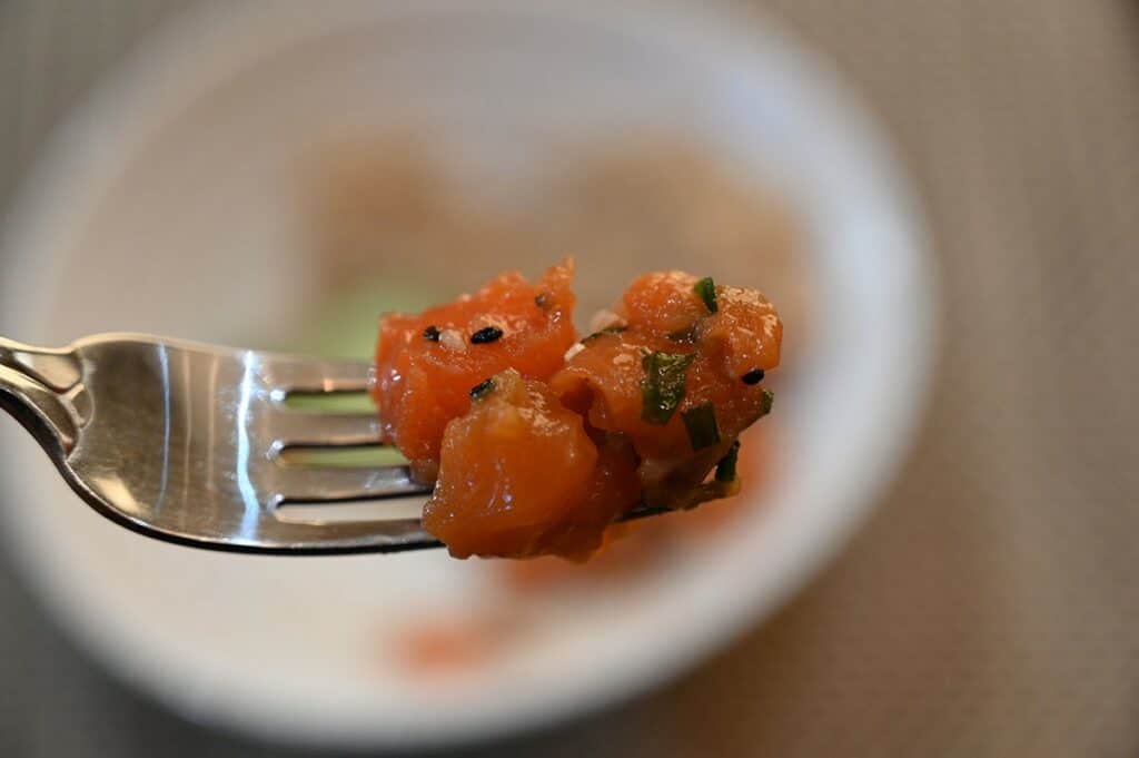 Costco Dom Reserve Singles Steelhead Salmon Poke placed on a fork to see up close. 