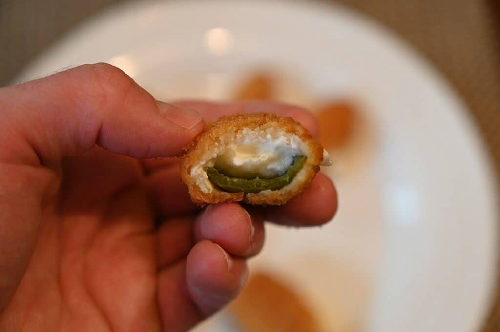 Costco The Original Poppers Stuffed Jalapenos close up of one cooked with a bite out of it