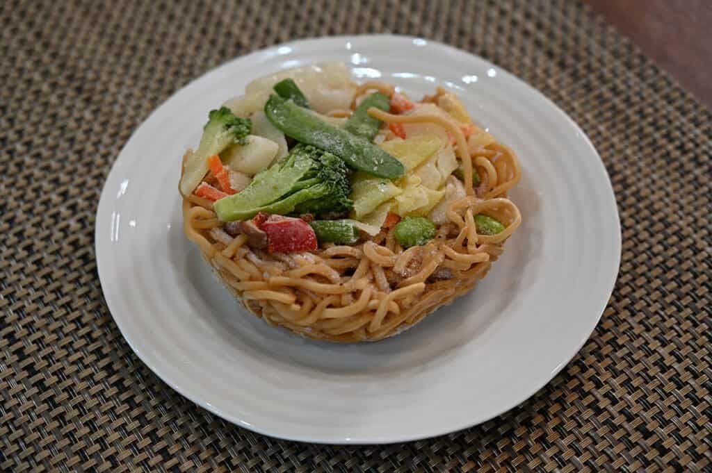 One of the servings of the Vegetable Yakisoba removed from the plastic bag - each serving comes as a frozen disc.