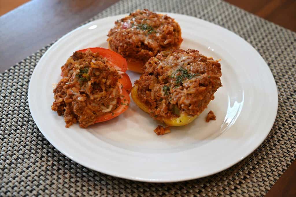 Three of the stuffed bell pepper halves on a plate.