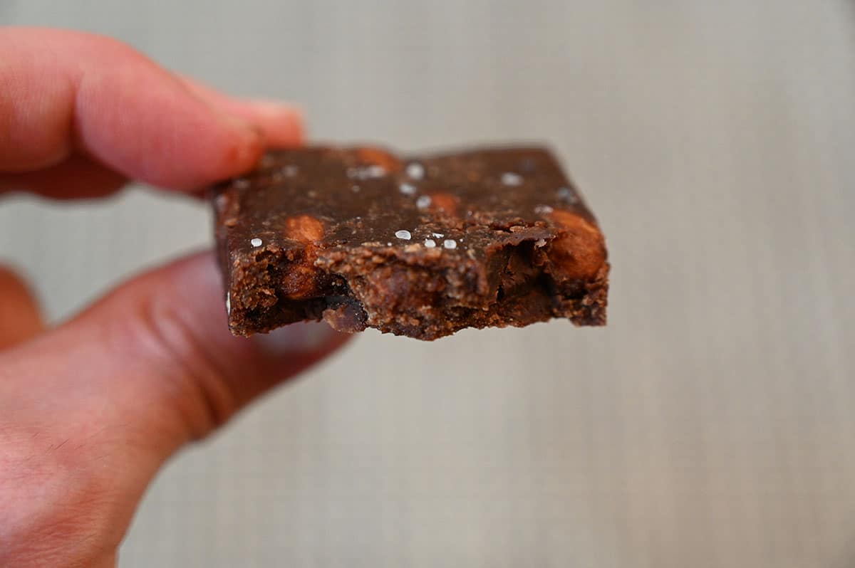 A close-up of the Chocolate Sea Salt RXBAR with a bite out of it.